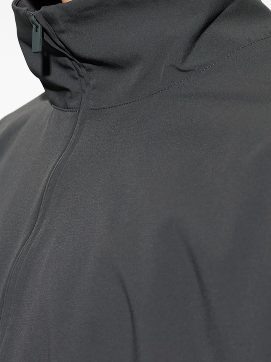 Close up of grey jacket, showing texture of the Nylon fabric