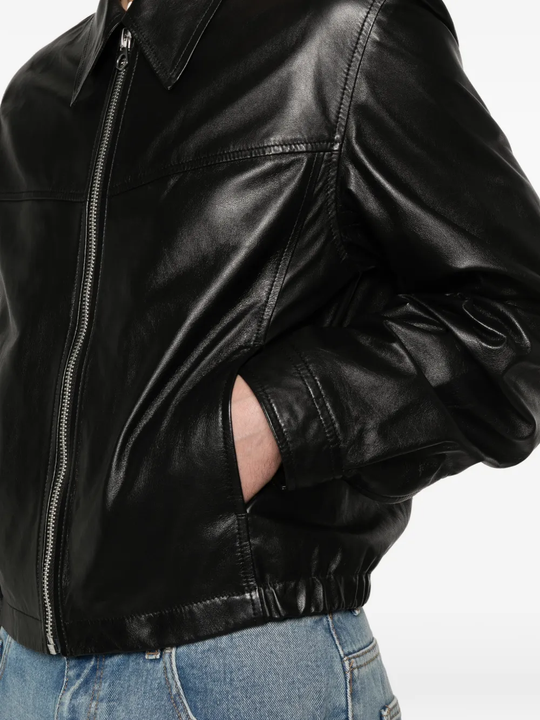 Close up of black leather jacket,showing texture of the cotton fabric
