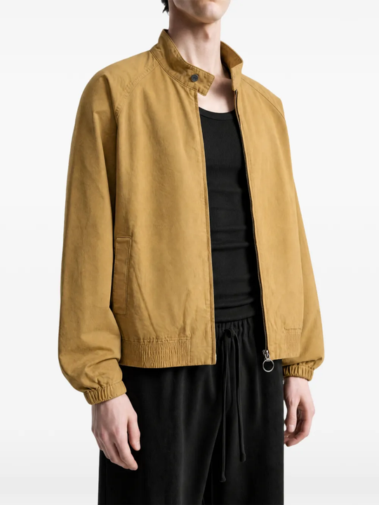 Brown jacket worn by a person, showing the jacket fit