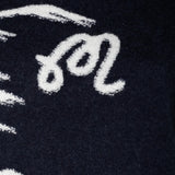 Close up of Navy hoodie, showing texture of the 50% acrylic/ 32% nylon/ 12% wool/ 6% cashmere fabric