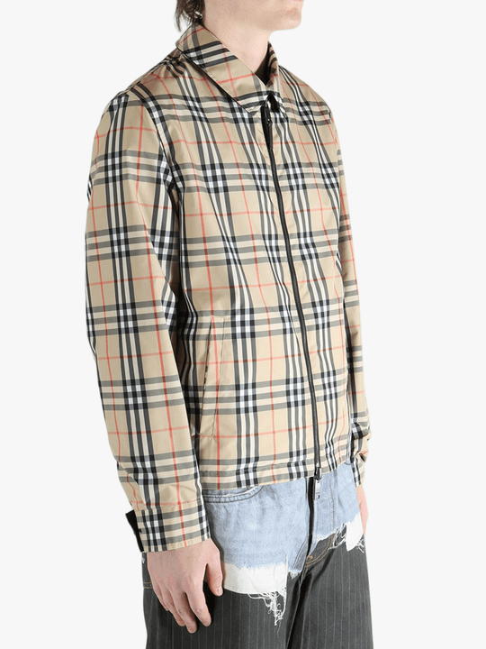 Yellow  jacket worn by a person, showing the  jacket's fit
