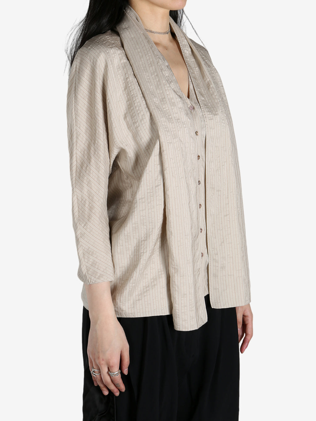 Tan shirts worn by a person, showing the shirts fit