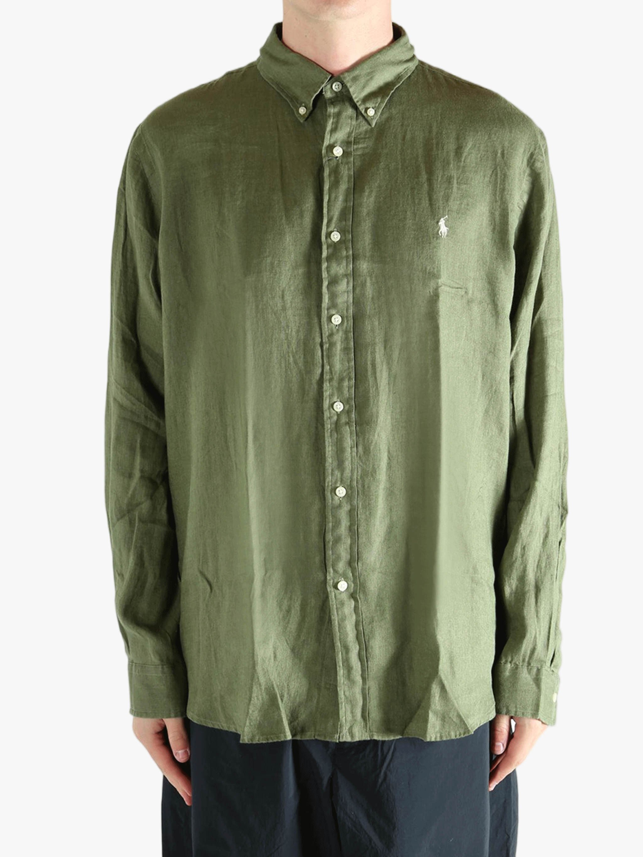 Green shirt worn by a person, showing the shirt's fit