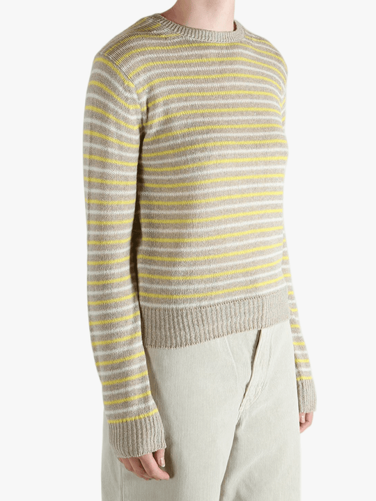 Yellow knitwear worn by a person, showing the knitwear fit
