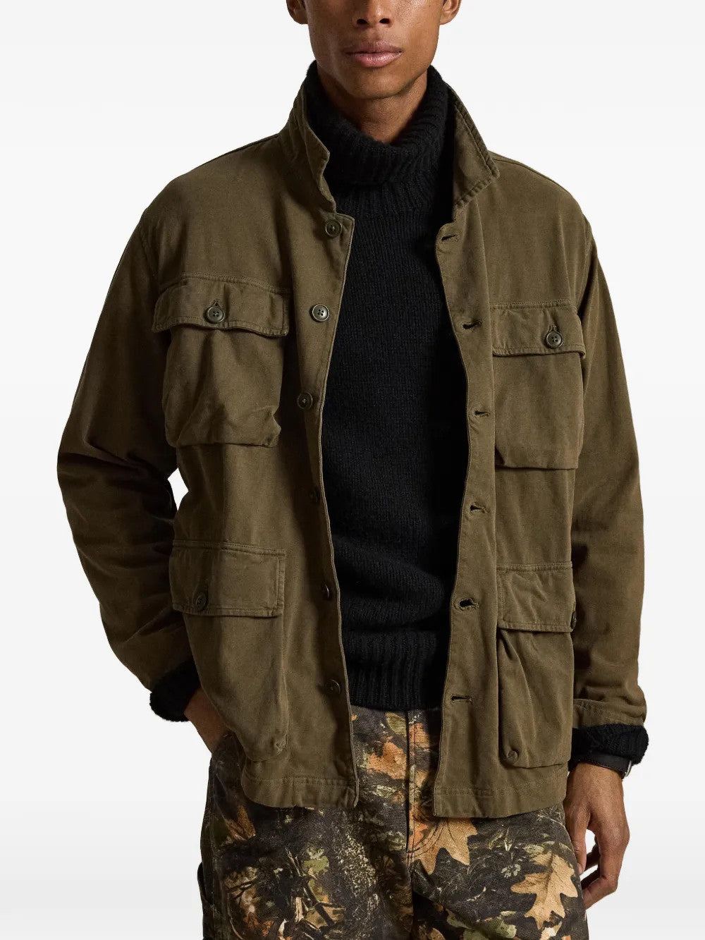 Green jacket worn by a person, showing the jacket fit