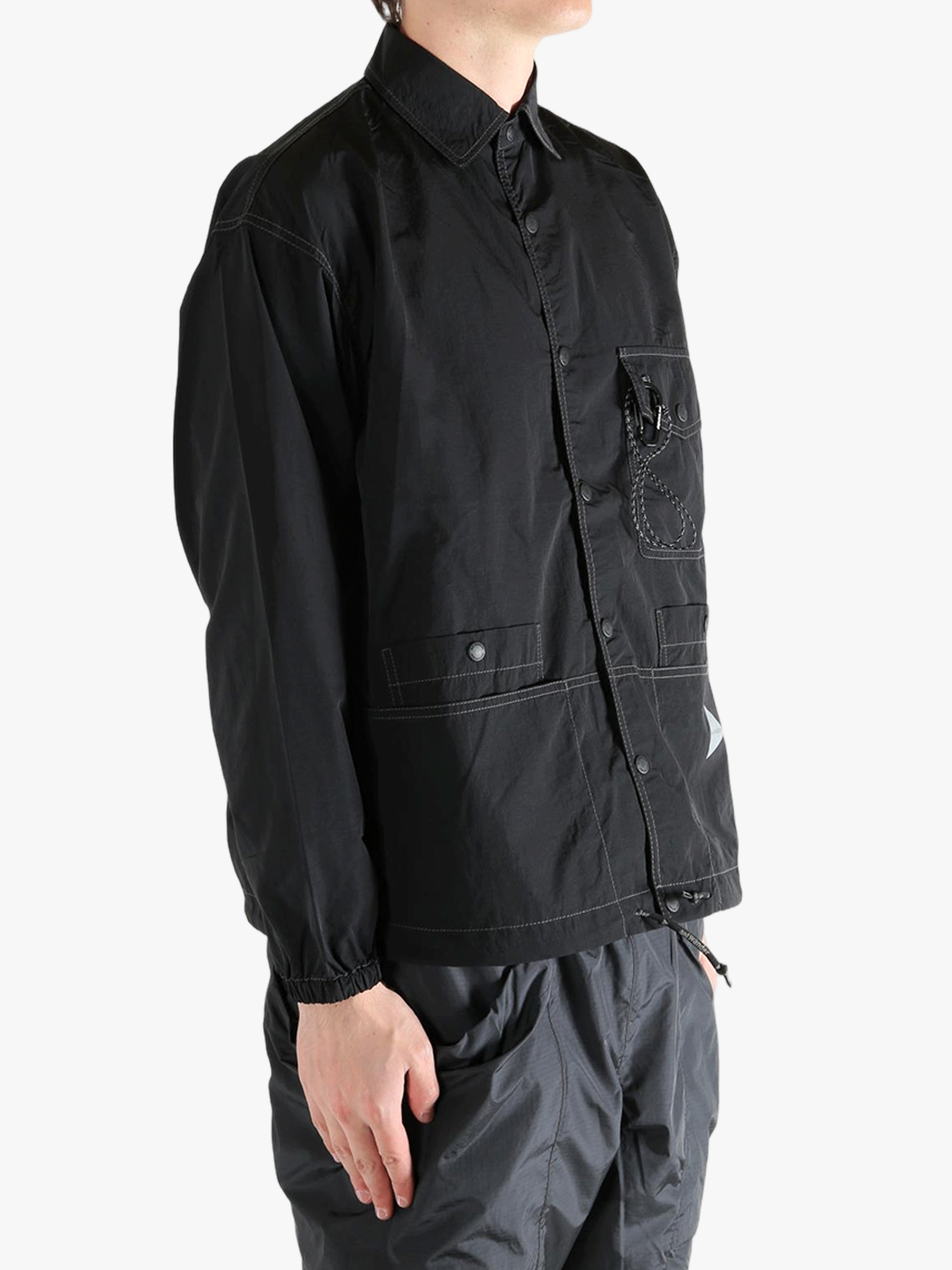 Black jackets worn by a person, showing the jackets fit