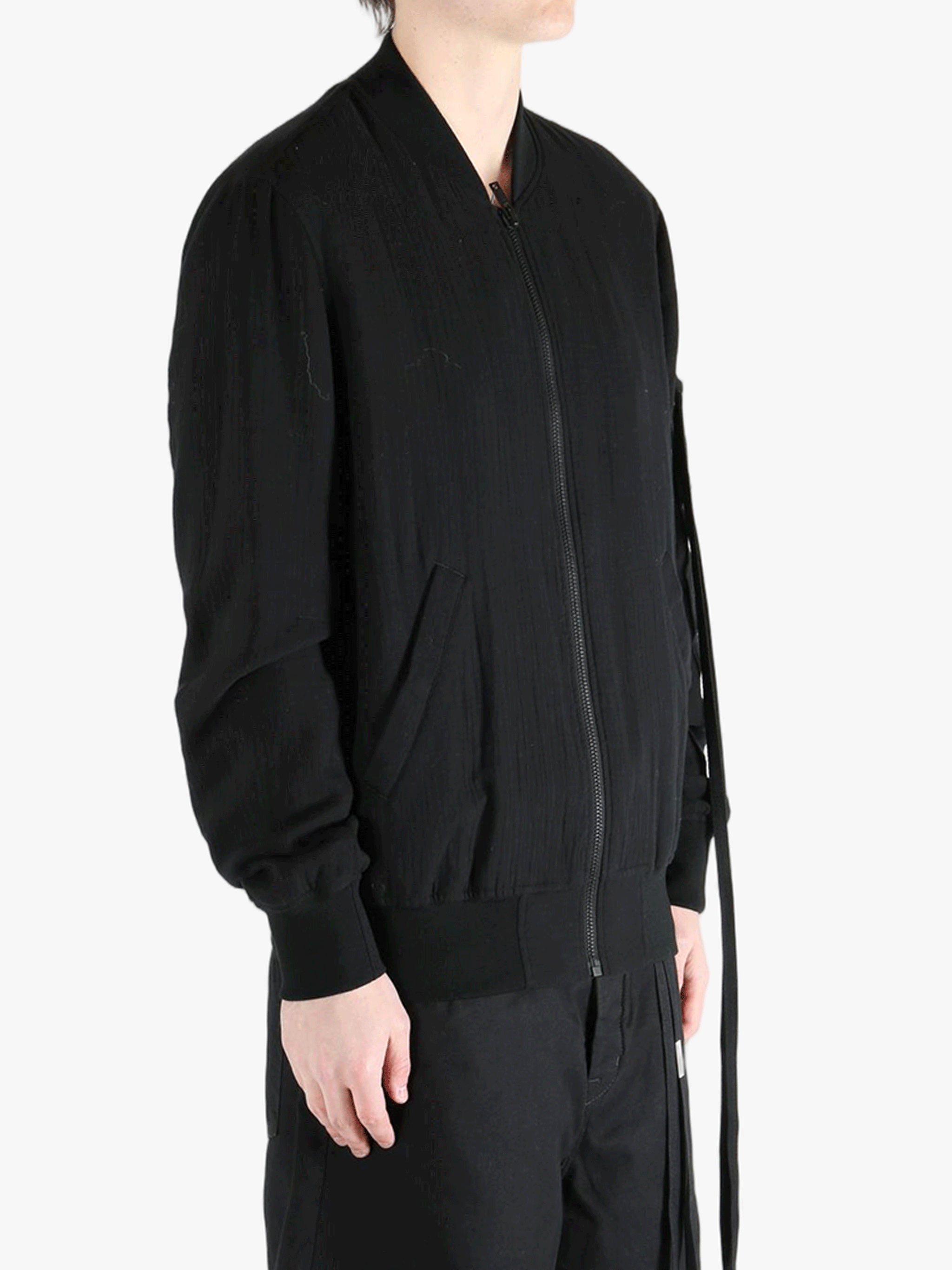 Black jackets-coats worn by a person, showing the cotton fit