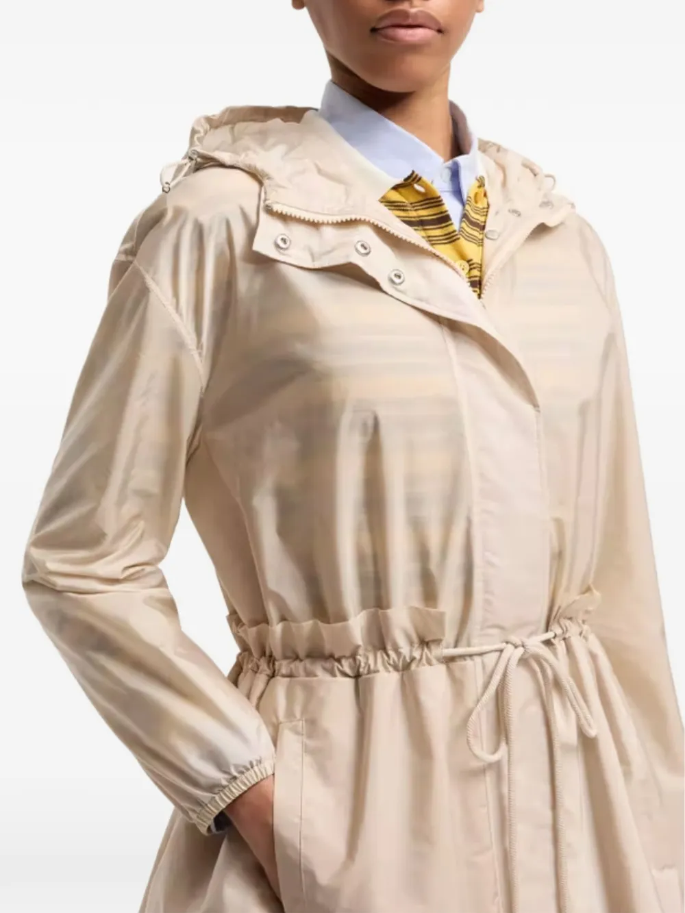 tan jackets-coat worn by a person, showing the jackets-coat's fit