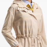 tan jackets-coat worn by a person, showing the jackets-coat's fit