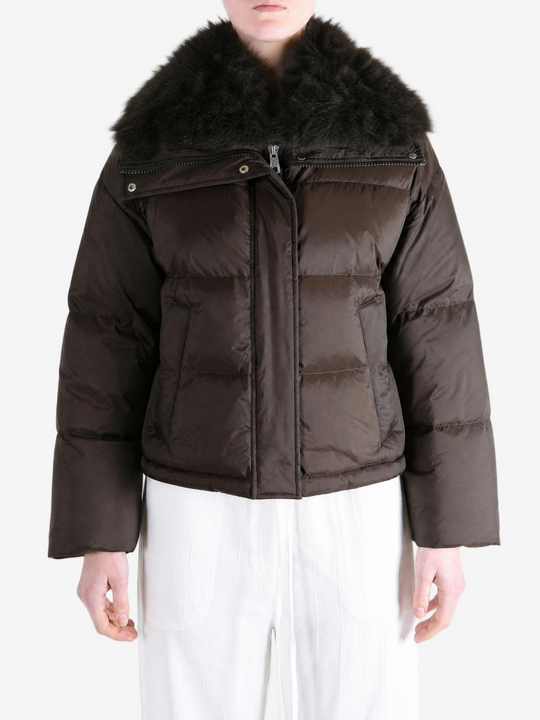 Brown jacket worn by a person, showing the jacket fit