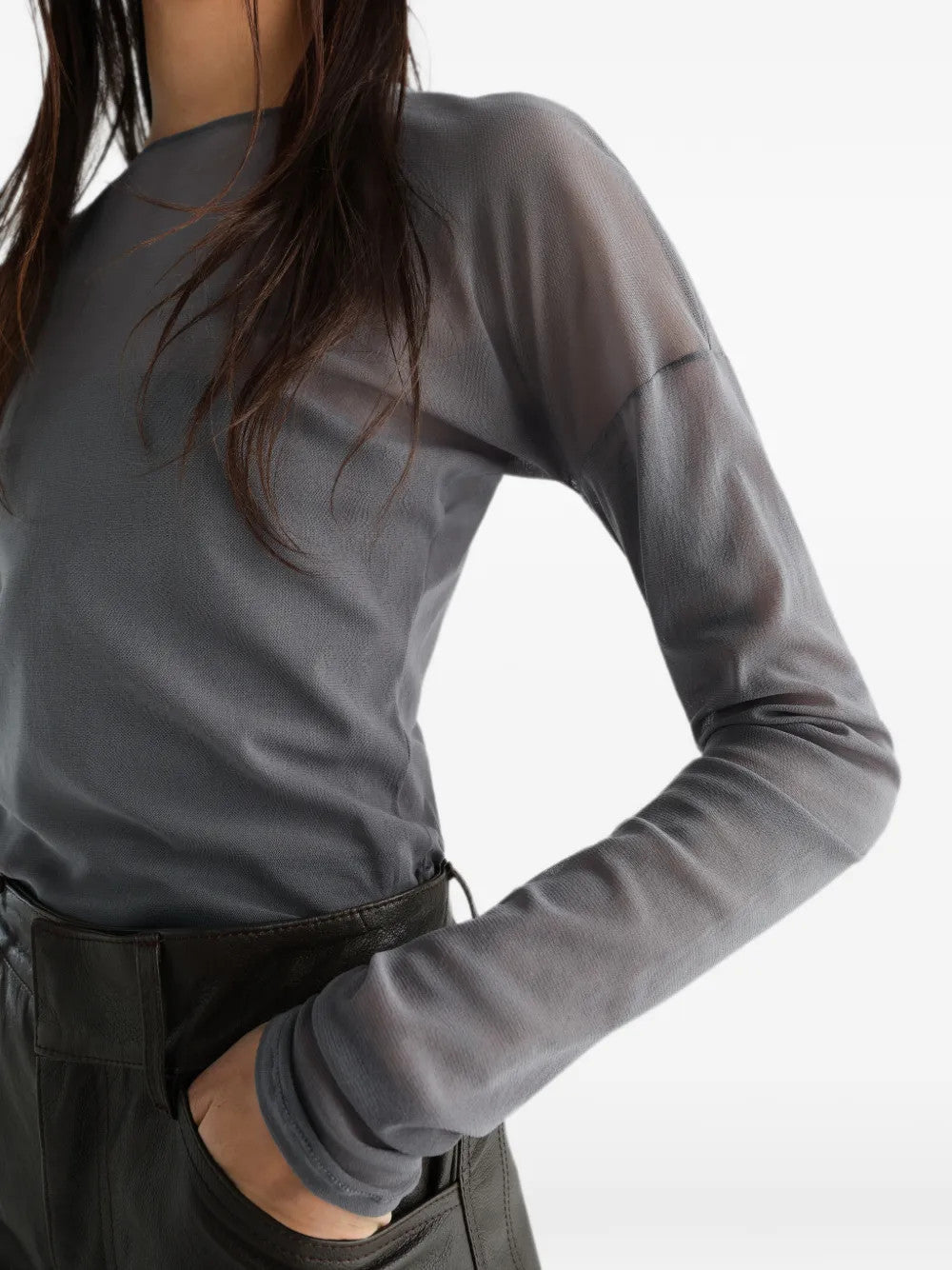 Grey top worn by a person, showing the top fit