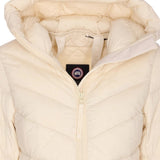 Close up of the tan jacket, showing texture of the nylon fabric