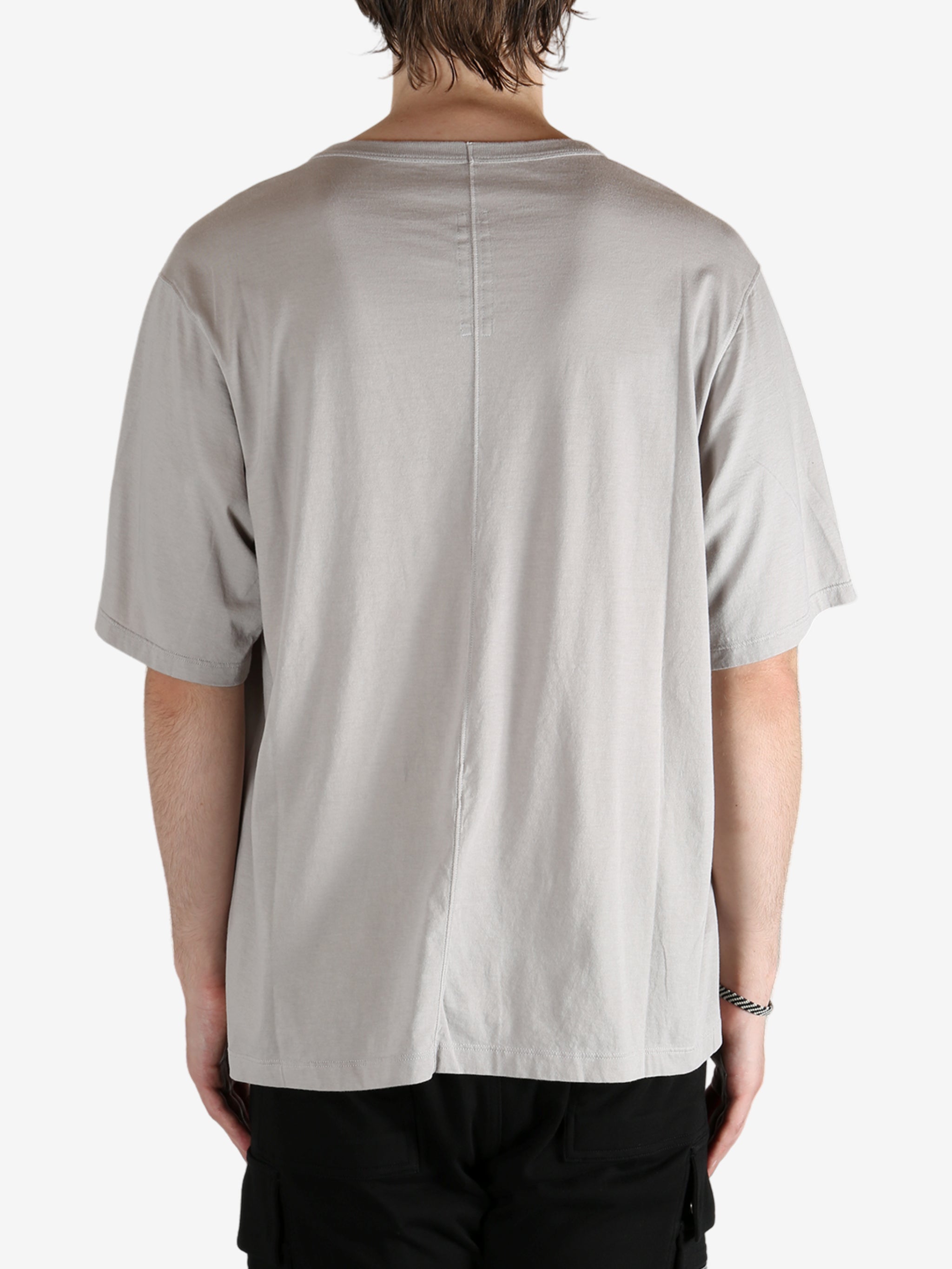 Grey shirts worn by a person, showing the shirt's fit