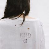 Close up of the white t-shirt, showing texture of the cotton fabric