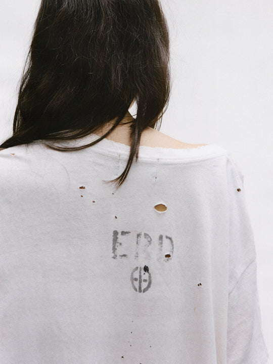 Close up of the white t-shirt, showing texture of the cotton fabric