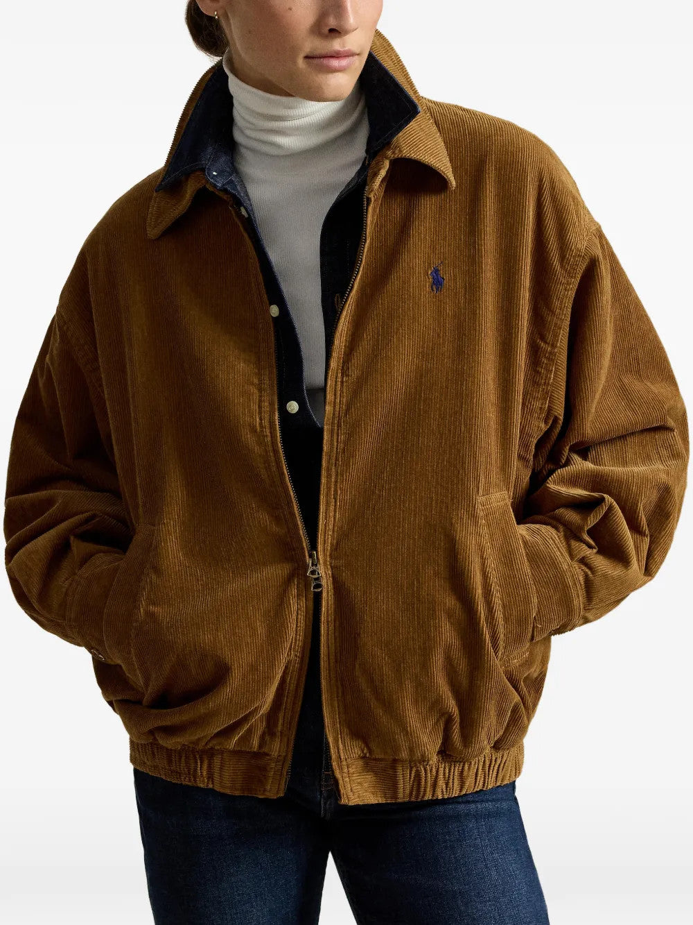 Brown jacket worn by a person, showing the jacket fit