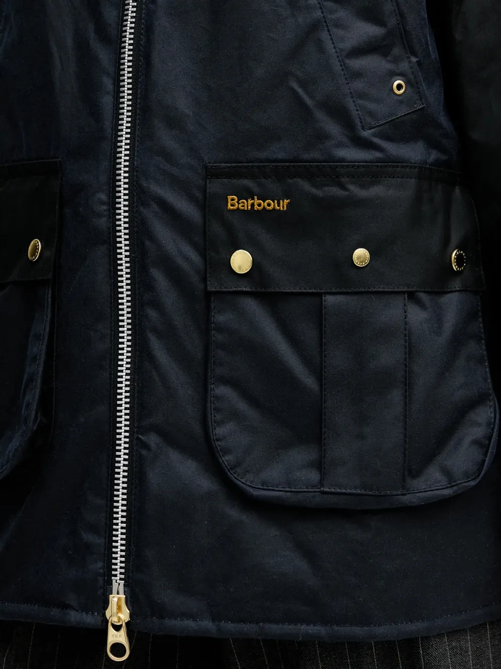 Close up of Black jacket, showing texture of the 100% cotton fabric