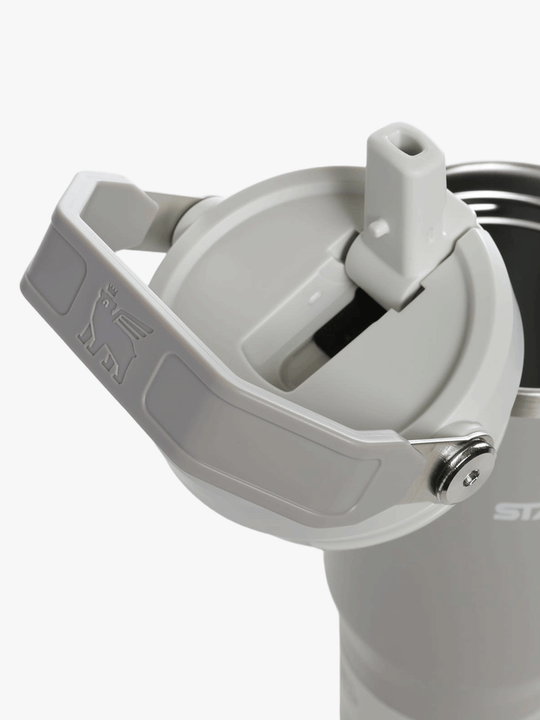 Close up of grey tumbler, showing texture of the steel fabric