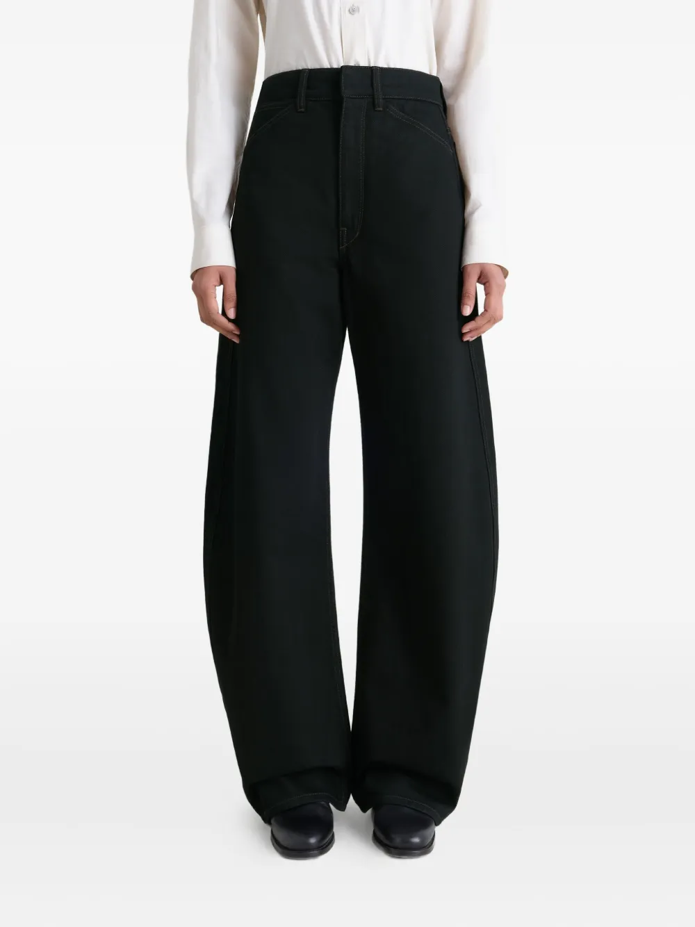 Black pants worn by a person, showing the pants fit