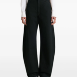 Black pants worn by a person, showing the pants fit