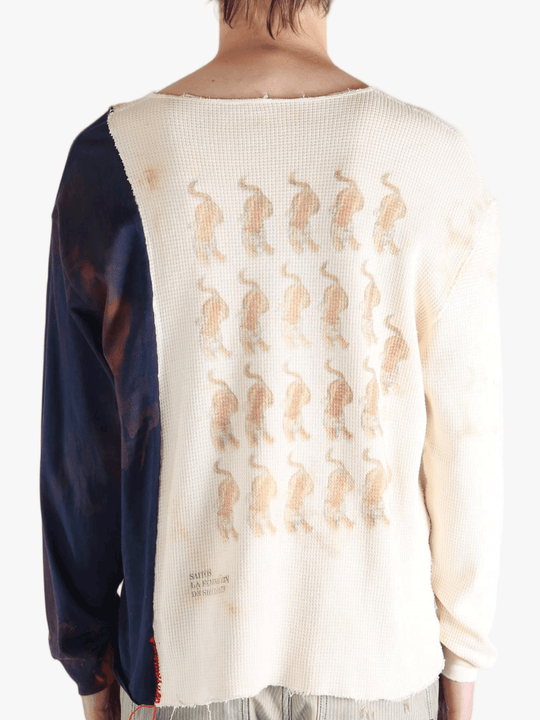 White knitwear worn by a person, showing the knitwear fit