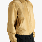 Yellow blouson worn by a person, showing the blouson's fit