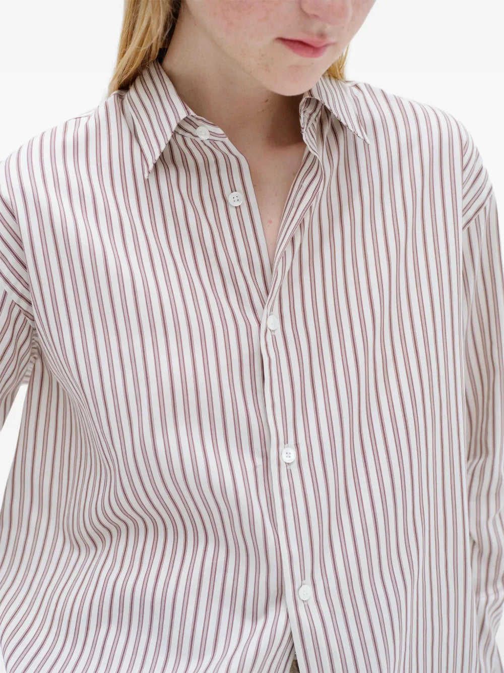 Burgundy shirt worn by a person, showing the shirt fit