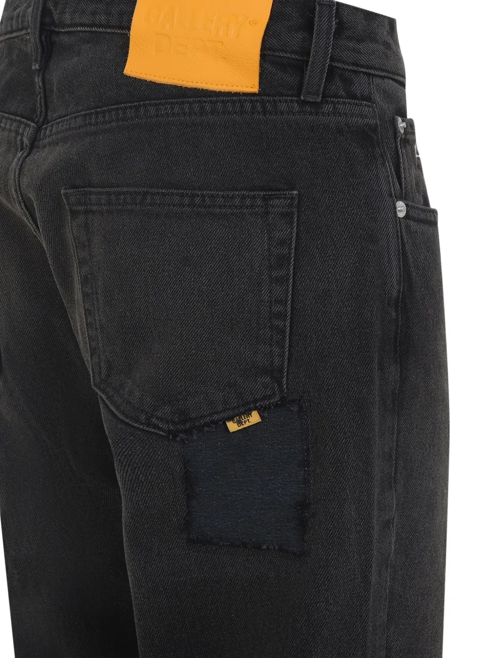 Close up of black jeans, showing texture of the cotton fabric