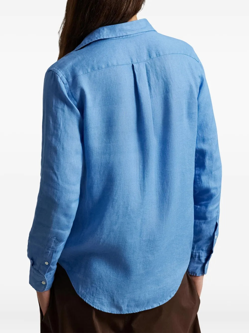 Blue shirt worn by a person, showing the shirt's fit