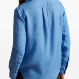 Blue shirt worn by a person, showing the shirt's fit