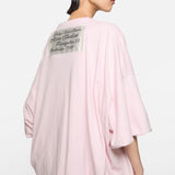 Pink t-shirt worn by a person, showing the t-shirt fit