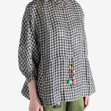 Black shirt worn by a person, showing the shirt's fit