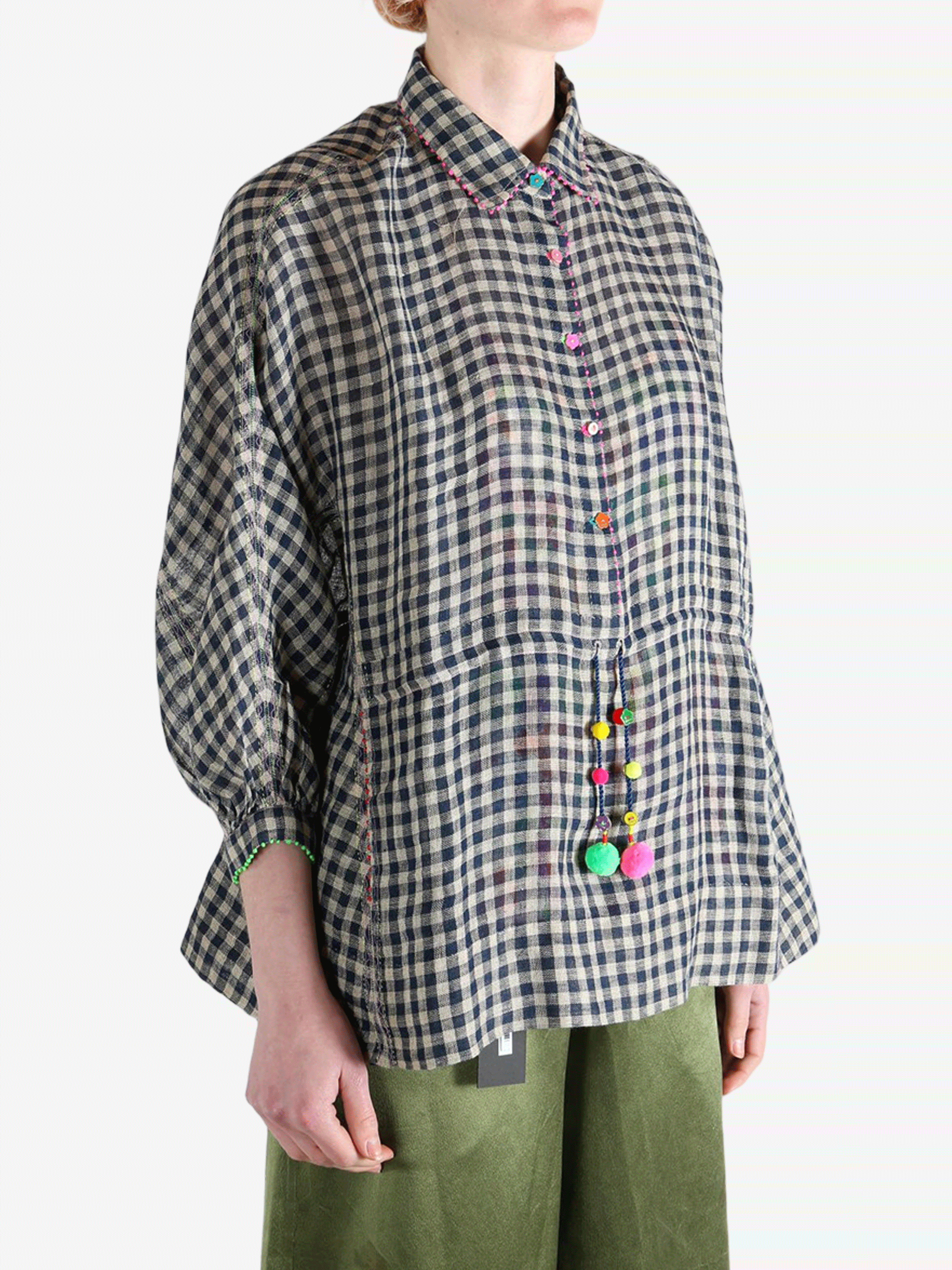 Black shirt worn by a person, showing the shirt's fit