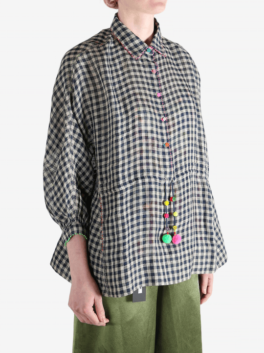 Black shirt worn by a person, showing the shirt's fit