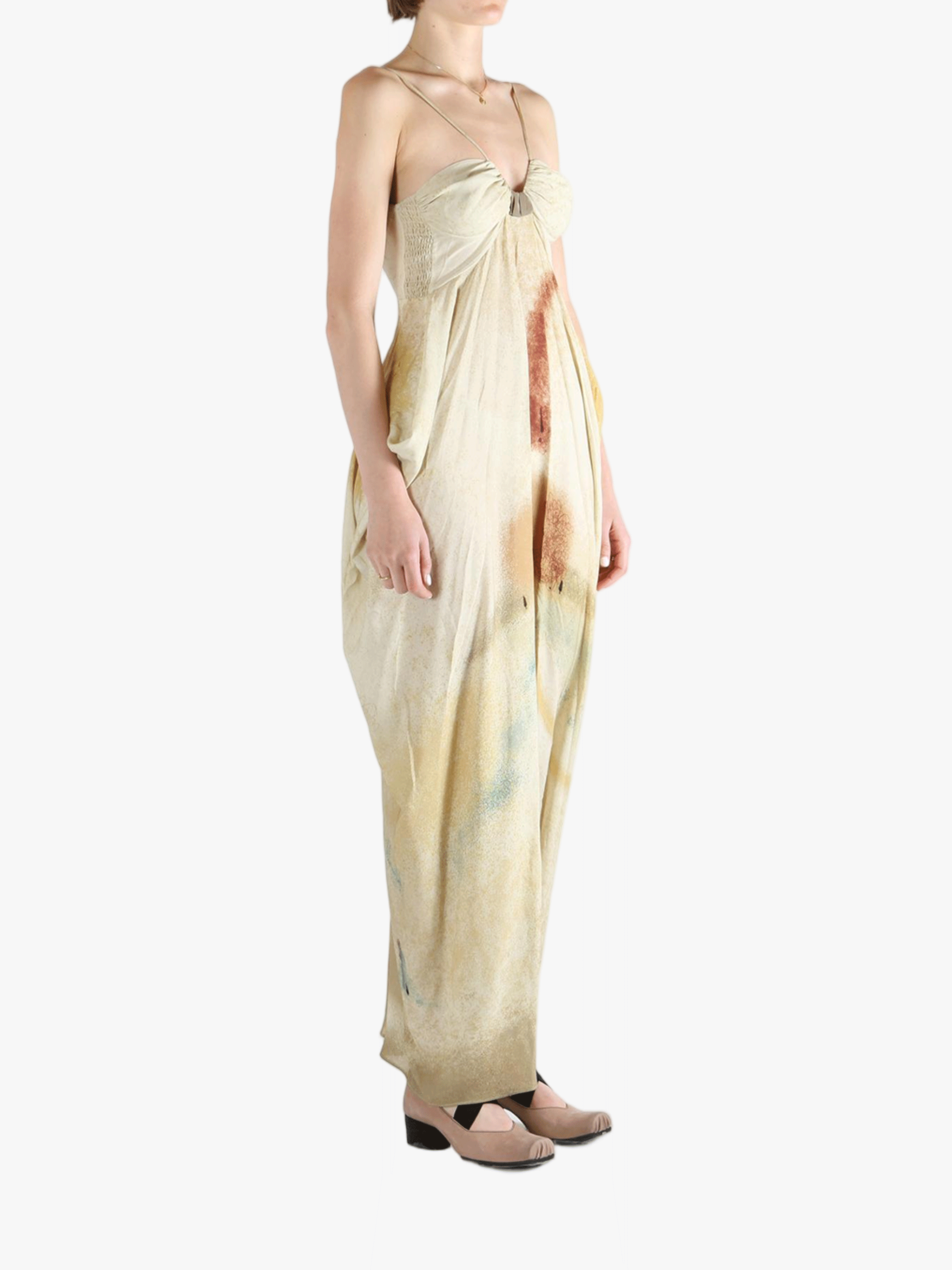 White dress worn by a person, showing the loose fit.