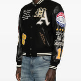 Black jackets worn by a person, showing the jackets fit