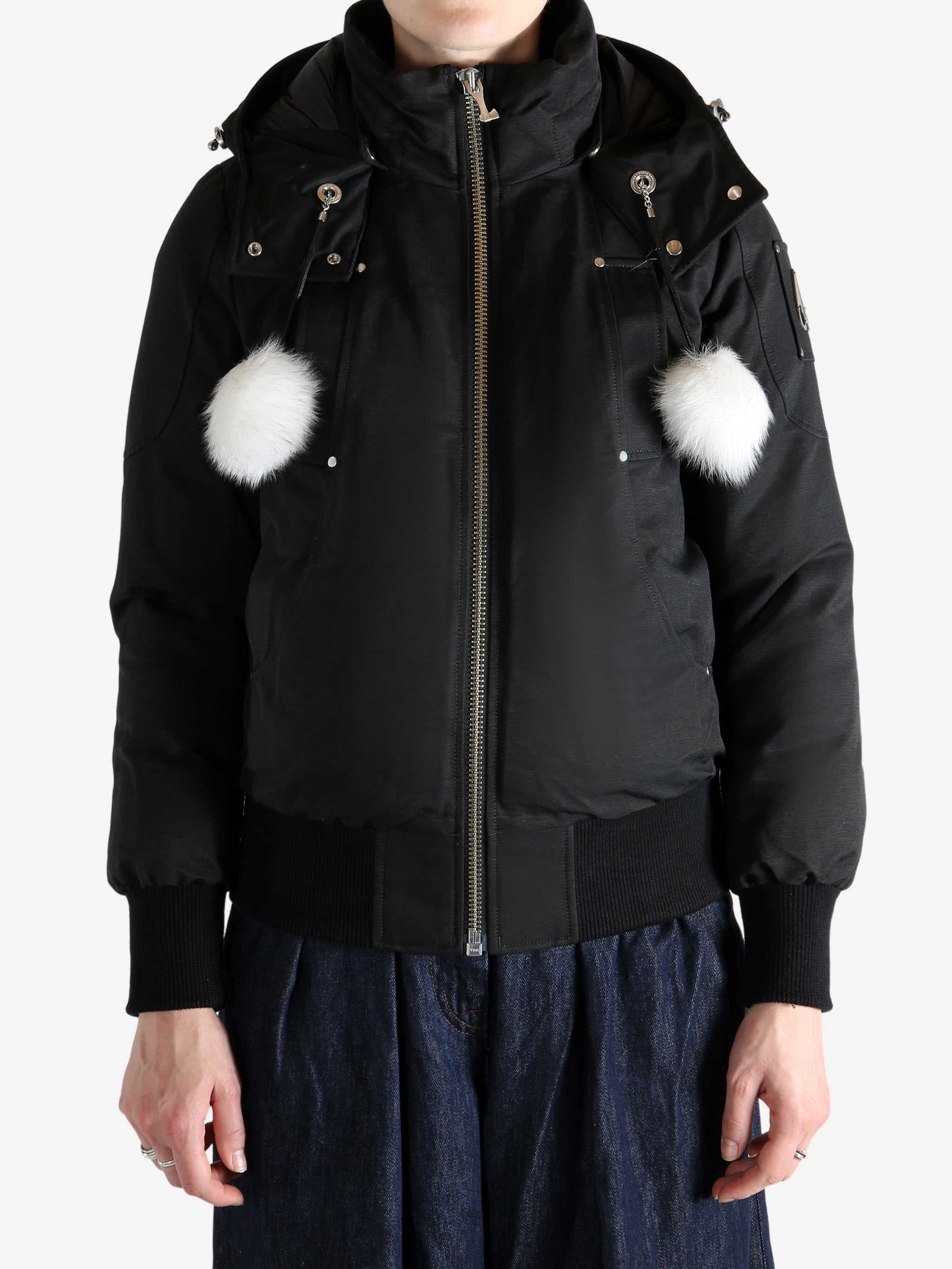 Black jacket worn by a person, showing the jacket's fit