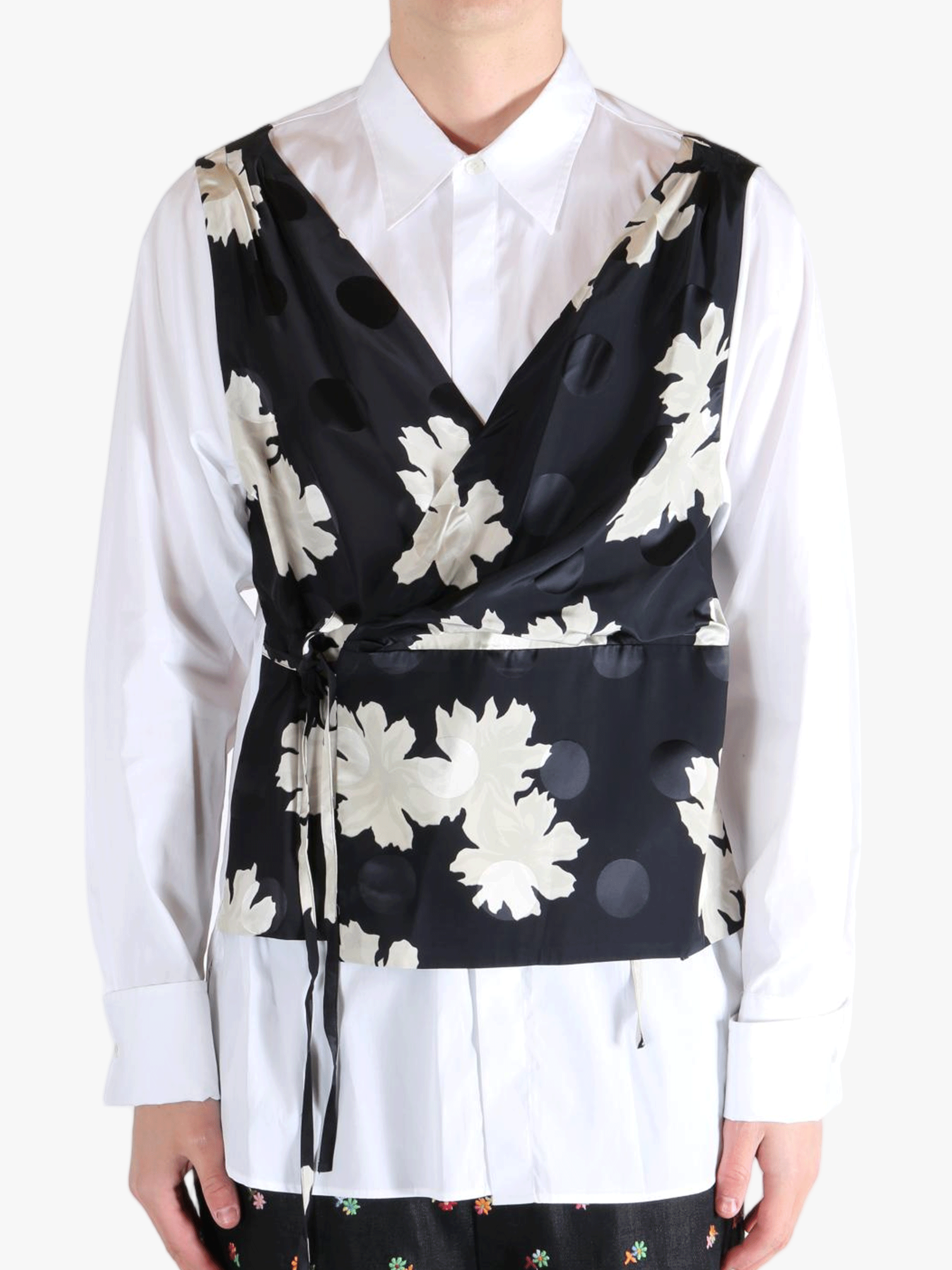 White shirt worn by a person, showing the shirt's fit