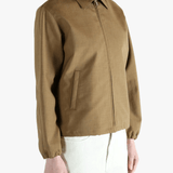 Brown jacket worn by a person, showing the jacket fit