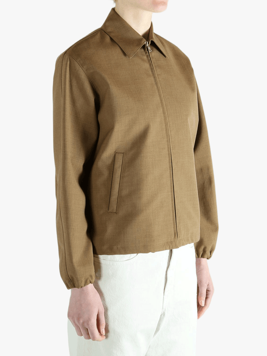 Brown jacket worn by a person, showing the jacket fit