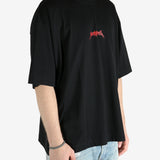 Black t-shirt worn by a person, showing the shirt's fit