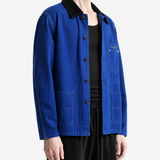 Blue jacket worn by a person, showing the jacket fit