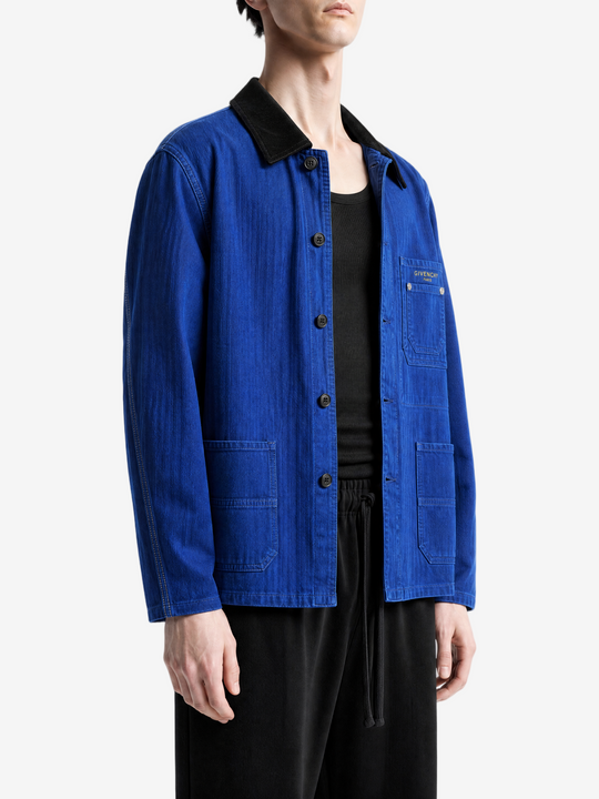 Blue jacket worn by a person, showing the jacket fit