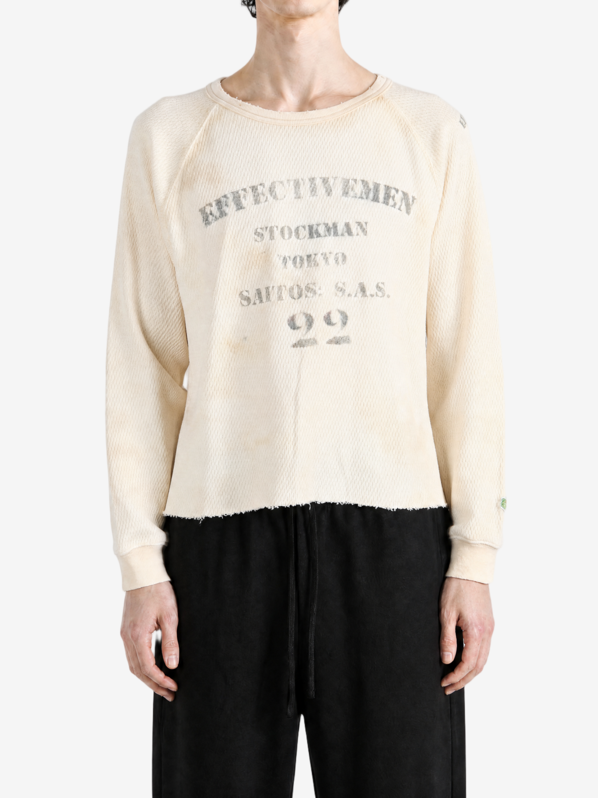 Tan top worn by a person, showing the top fit