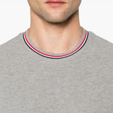 Close up of grey t-shirt, showing texture of the cotton fabric