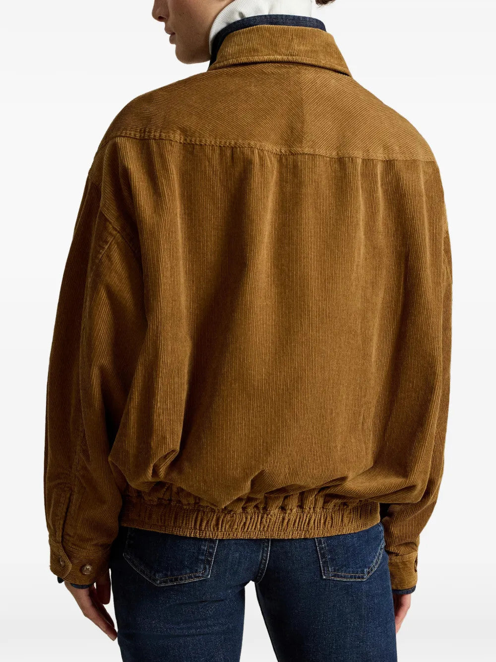 Brown jacket worn by a person, showing the jacket fit