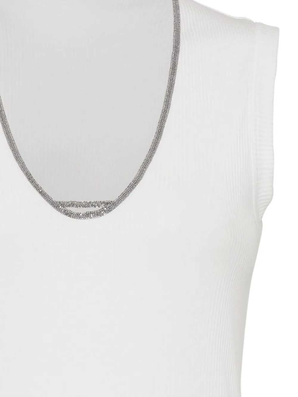 Close up of white tops, showing texture of the cotton and elastane fabric