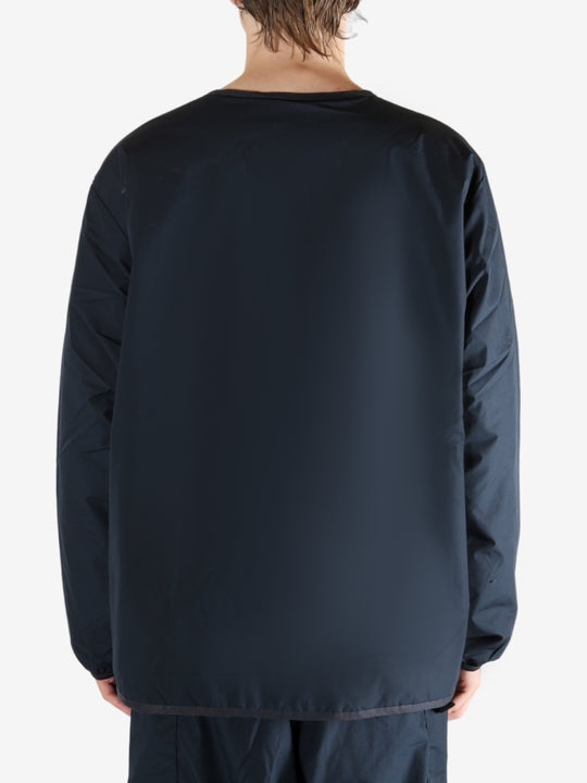 Navy cardigan worn by a person, showing the cardigan's fit