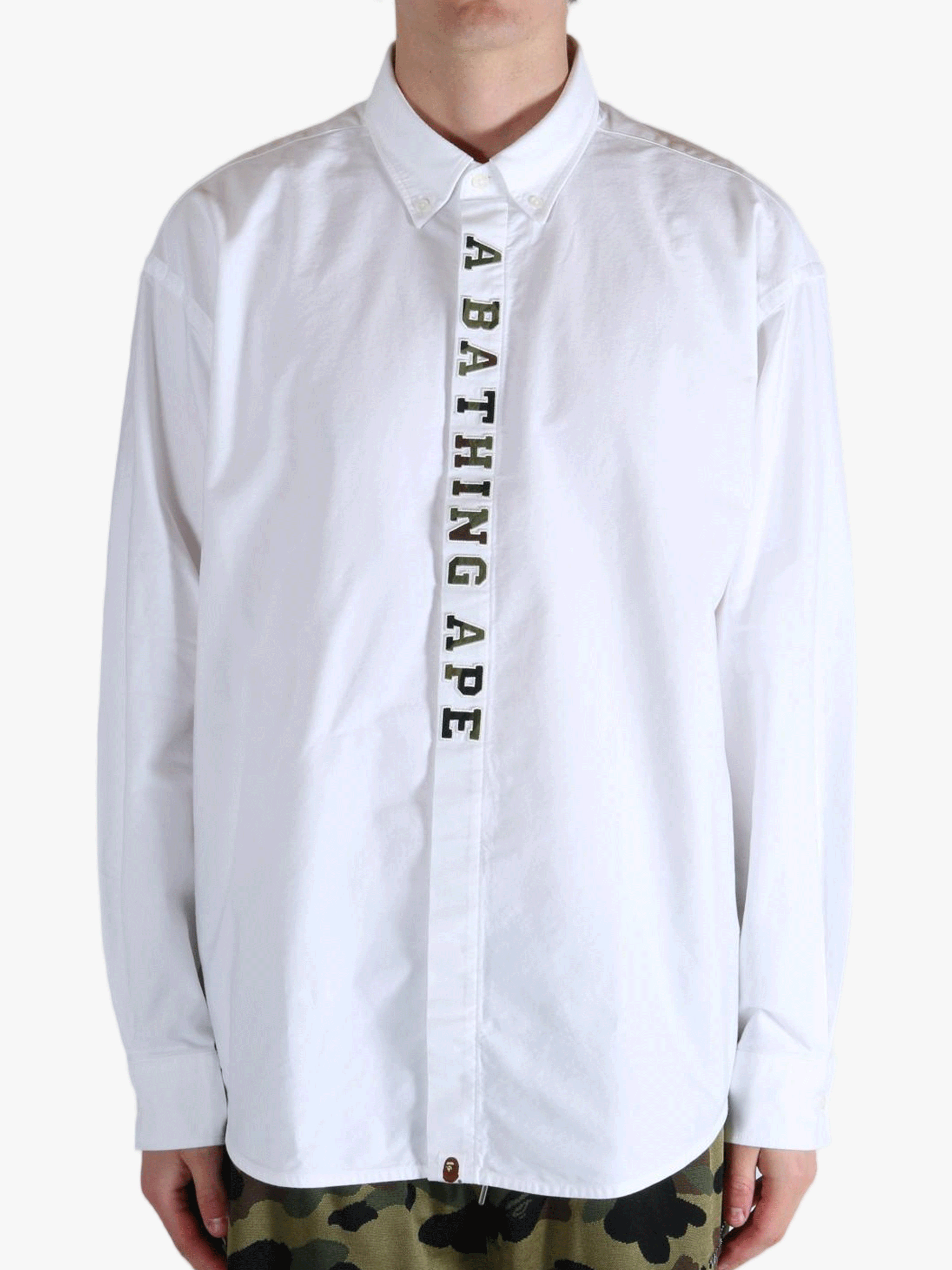 White shirt worn by a person, showing the shirt's fit