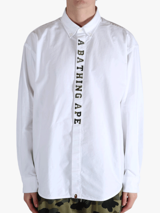 White shirt worn by a person, showing the shirt's fit